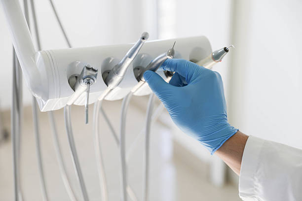 Professional Tooth Extraction technician working in Raleigh, NC